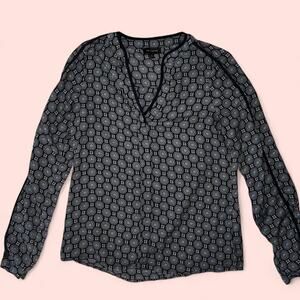 The limited blue and black blouse